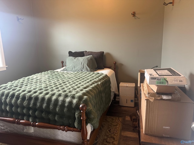 bedroom with dark hardwood / wood-style floors