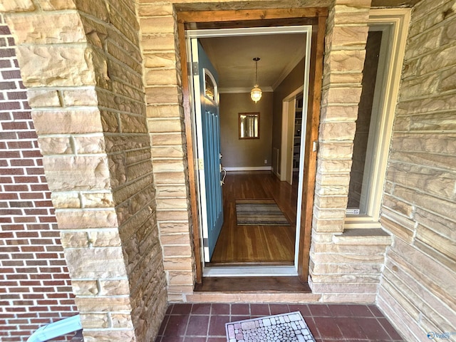 property entrance featuring brick siding and stone siding