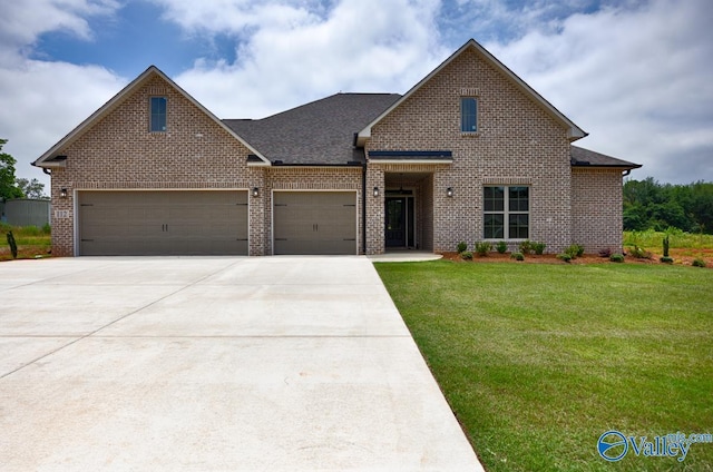 traditional home with brick siding, a front yard, roof with shingles, driveway, and an attached garage