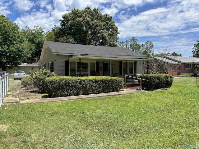 single story home featuring fence, a porch, and a front yard