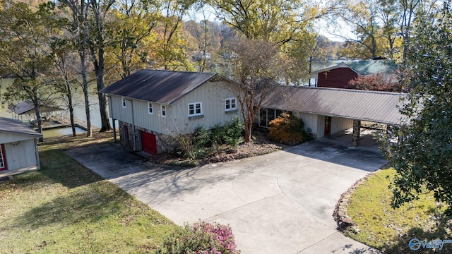 exterior space featuring a front yard and a carport