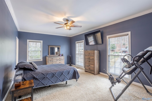 bedroom featuring ceiling fan, carpet, and ornamental molding