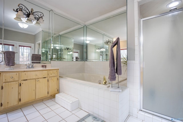 bathroom featuring tile patterned floors, vanity, ornamental molding, and shower with separate bathtub