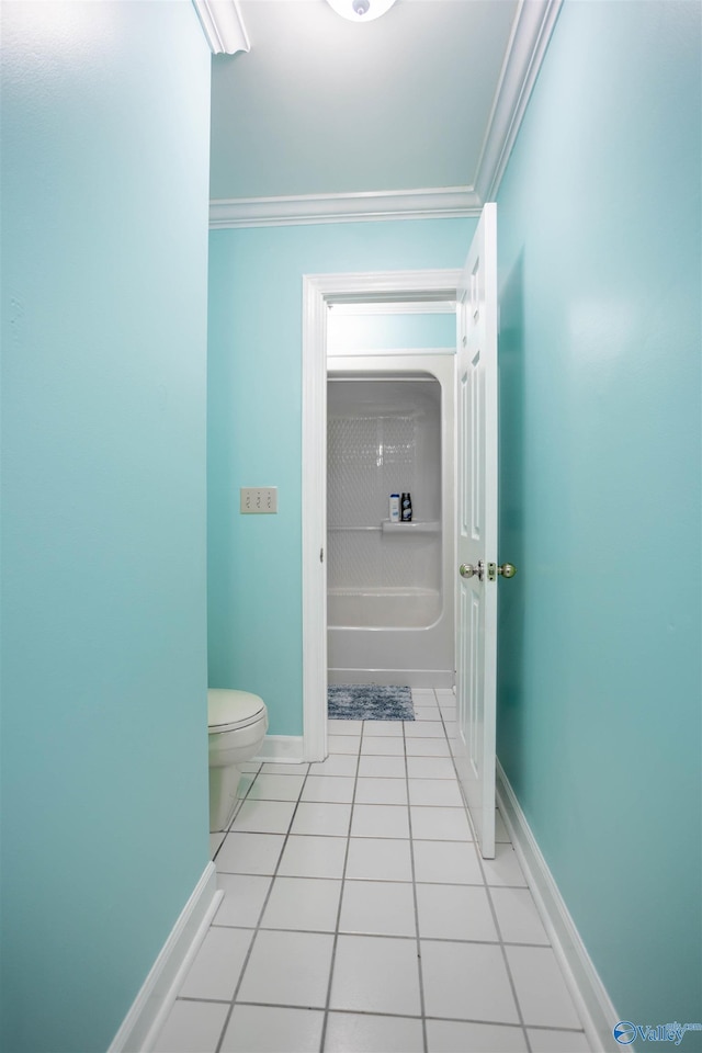 bathroom featuring toilet, tile patterned floors, and crown molding