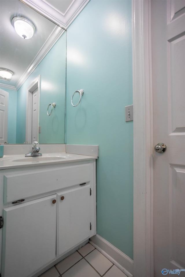 bathroom with tile patterned flooring, vanity, and ornamental molding