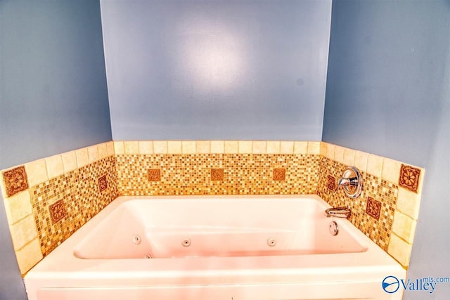 full bathroom with a whirlpool tub