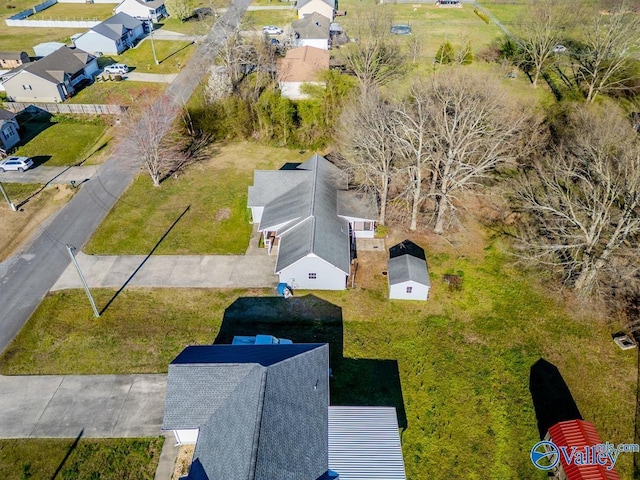 birds eye view of property with a residential view