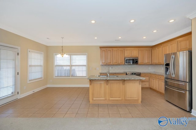 kitchen with appliances with stainless steel finishes, tasteful backsplash, sink, a kitchen island with sink, and light tile patterned floors