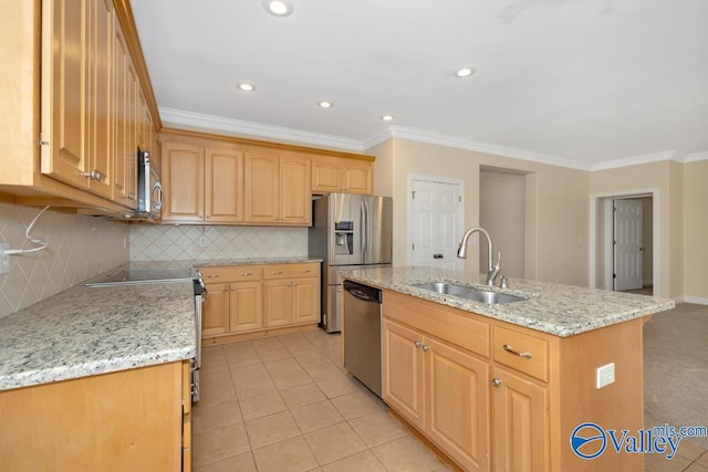 kitchen with appliances with stainless steel finishes, decorative backsplash, sink, an island with sink, and light tile patterned floors