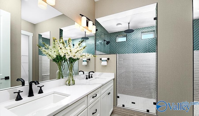 full bath with walk in shower and double vanity