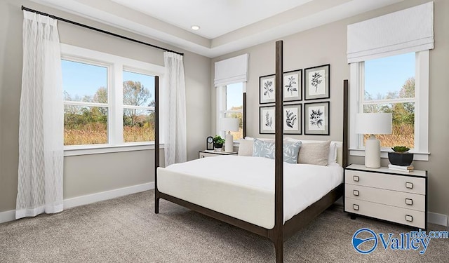 bedroom with dark carpet, multiple windows, baseboards, and recessed lighting