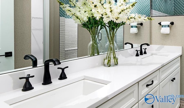 bathroom featuring double vanity