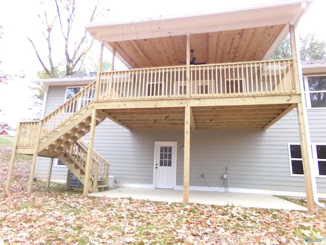 back of property featuring a patio and a deck