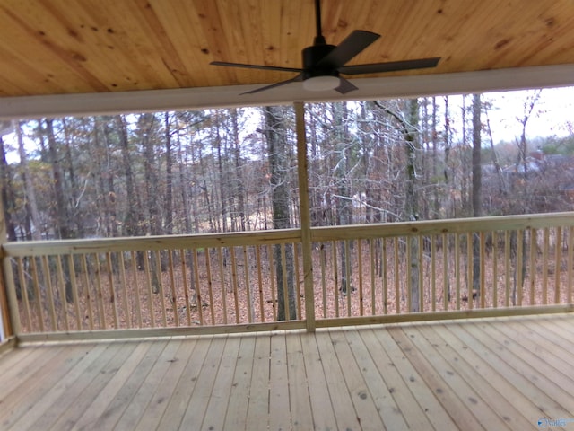 wooden deck featuring ceiling fan