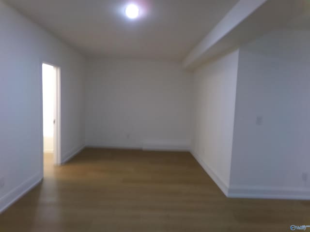 spare room with hardwood / wood-style flooring