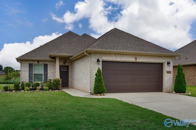 112 Elledge Farm Dr, Hazel Green, AL 35750 - view of front of home with brick siding, driveway, a garage, and a front lawn
