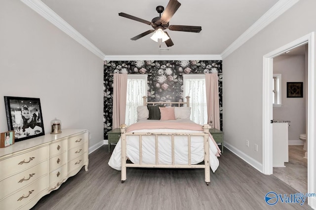 112 Elledge Farm Dr, Hazel Green, AL 35750 - bedroom with crown molding, wood finished floors, baseboards, and a ceiling fan