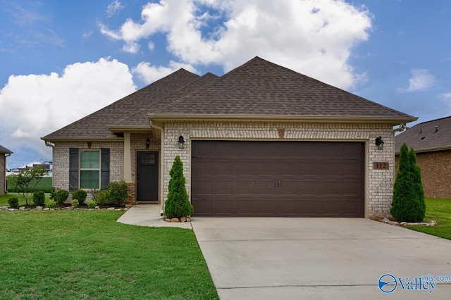 112 Elledge Farm Dr, Hazel Green, AL 35750 - view of front facade featuring brick siding, an attached garage, driveway, and a shingled roof