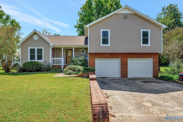 split level home with a garage, a porch, and a front lawn