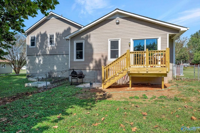 rear view of property with a lawn