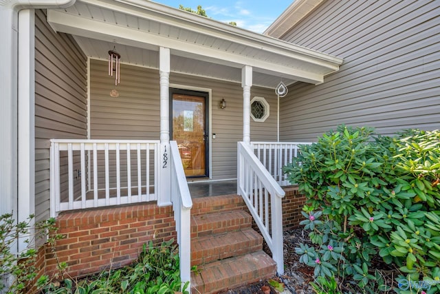 entrance to property featuring a porch