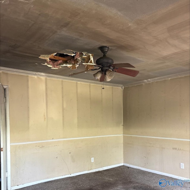 spare room featuring dark colored carpet, a ceiling fan, and baseboards