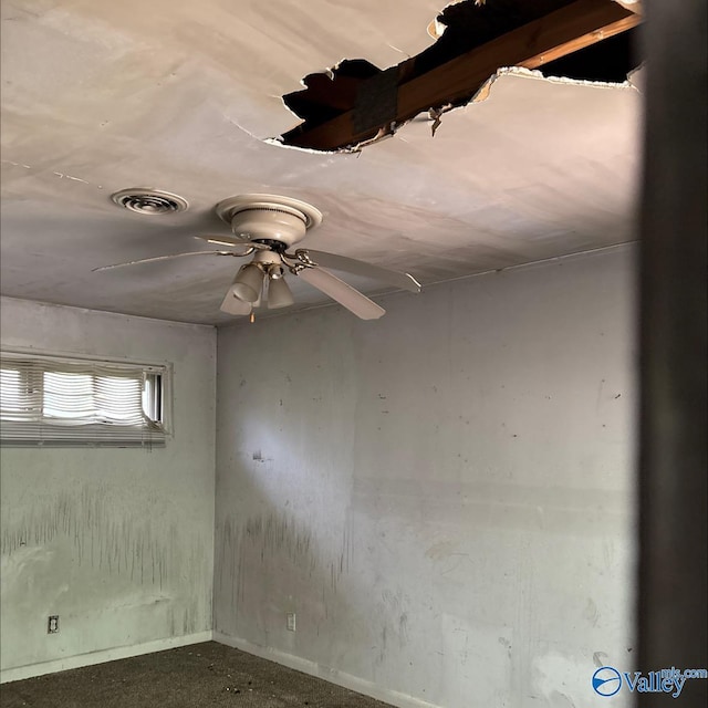unfurnished room with baseboards and visible vents