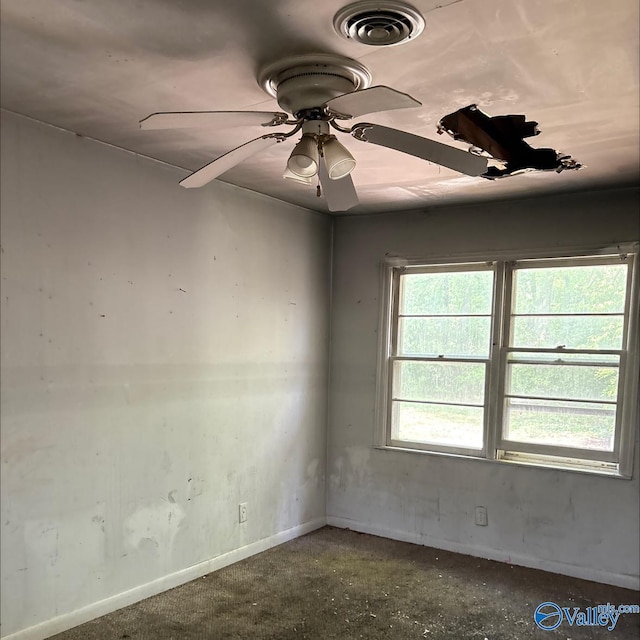 unfurnished room with visible vents, baseboards, and ceiling fan