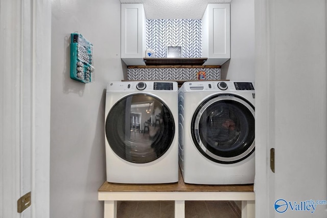 laundry area with cabinet space and washing machine and clothes dryer