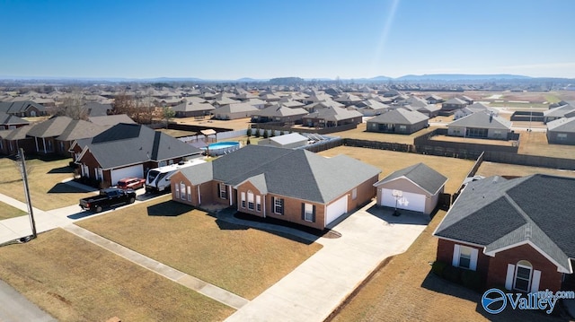 aerial view featuring a mountain view and a residential view