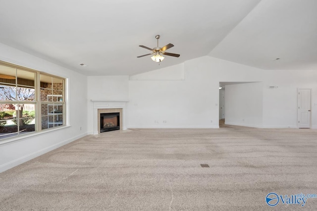 unfurnished living room featuring light carpet, ceiling fan, and lofted ceiling