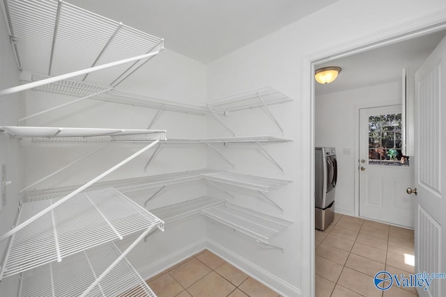 pantry featuring washer and dryer