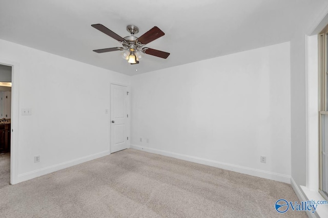 carpeted empty room with ceiling fan