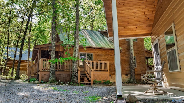 exterior space featuring a patio area and a deck