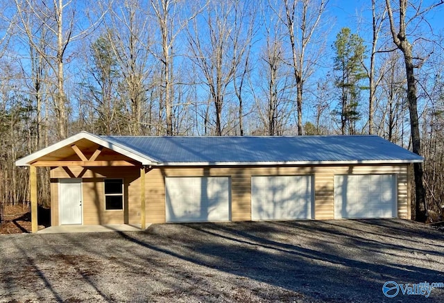 garage featuring wood walls