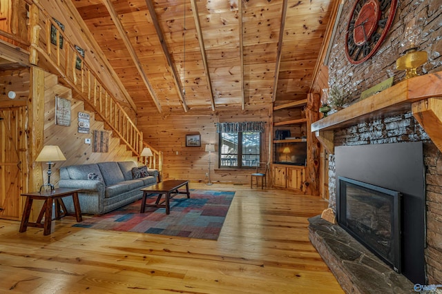 living room featuring a stone fireplace, wood walls, hardwood / wood-style floors, and wooden ceiling