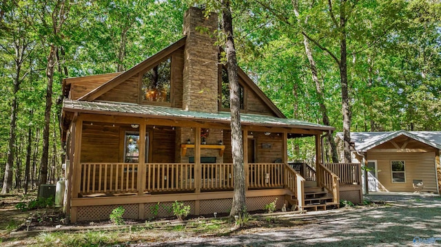 log-style house with a porch