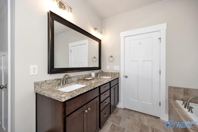 bathroom with vanity and a relaxing tiled tub