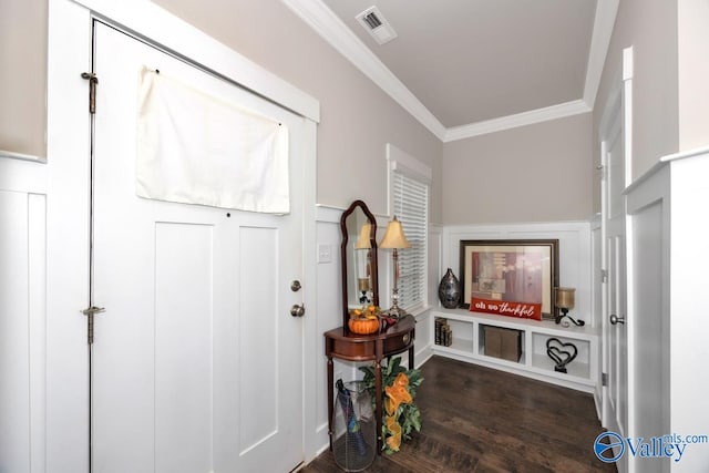 foyer with crown molding and dark hardwood / wood-style floors