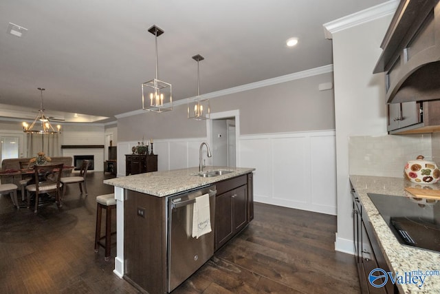 kitchen featuring sink, dishwasher, dark hardwood / wood-style floors, and pendant lighting