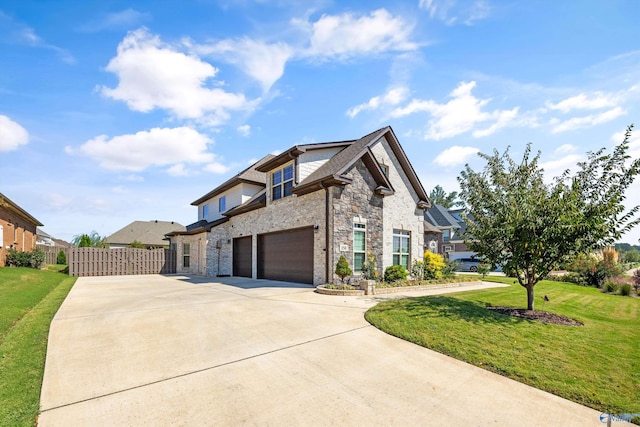 view of front of home featuring a garage and a front lawn