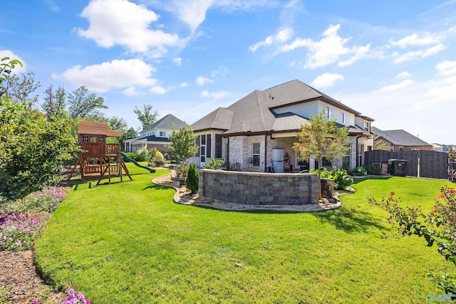 view of yard featuring a playground and a patio