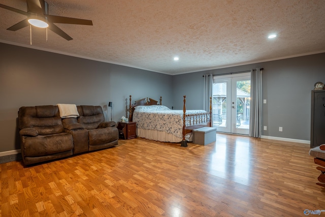 bedroom featuring french doors, access to outside, a textured ceiling, ceiling fan, and light hardwood / wood-style flooring