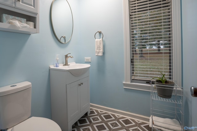 bathroom with toilet and vanity