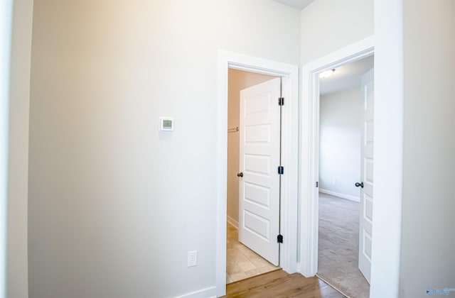 hallway featuring light wood-type flooring