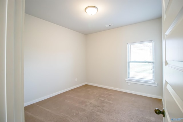 empty room with light colored carpet