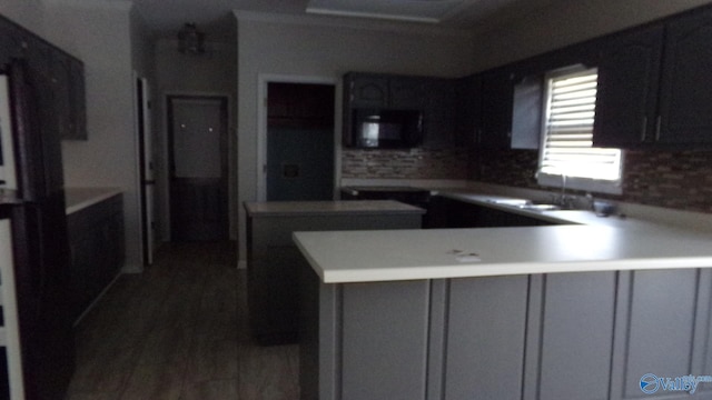 kitchen with gray cabinetry and kitchen peninsula