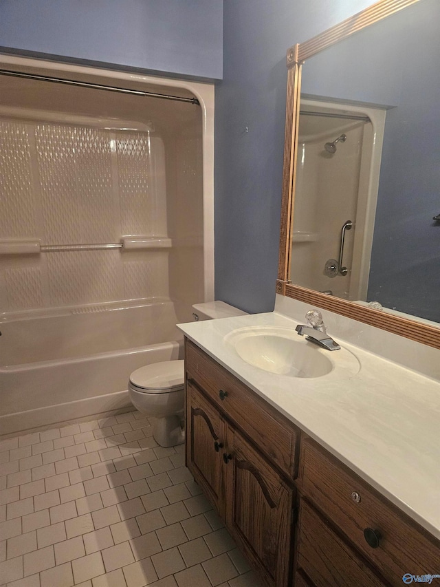 full bathroom with tile patterned flooring, vanity, bathtub / shower combination, and toilet