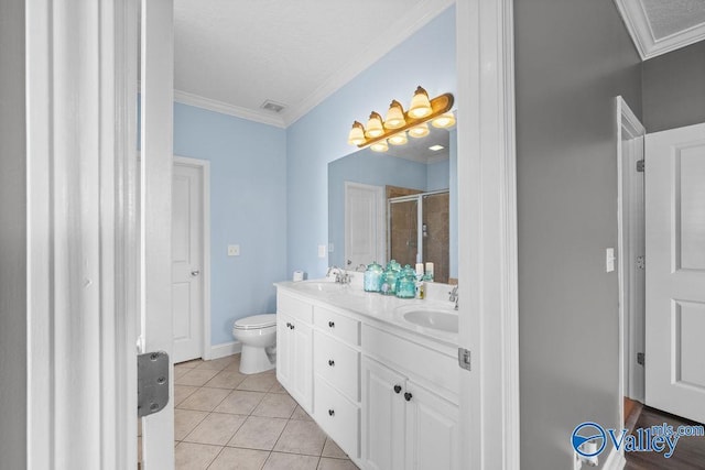 bathroom featuring a shower with shower door, ornamental molding, vanity, toilet, and tile patterned floors