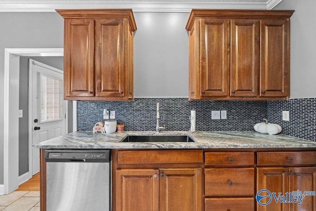 kitchen with sink, crown molding, light stone counters, decorative backsplash, and stainless steel dishwasher